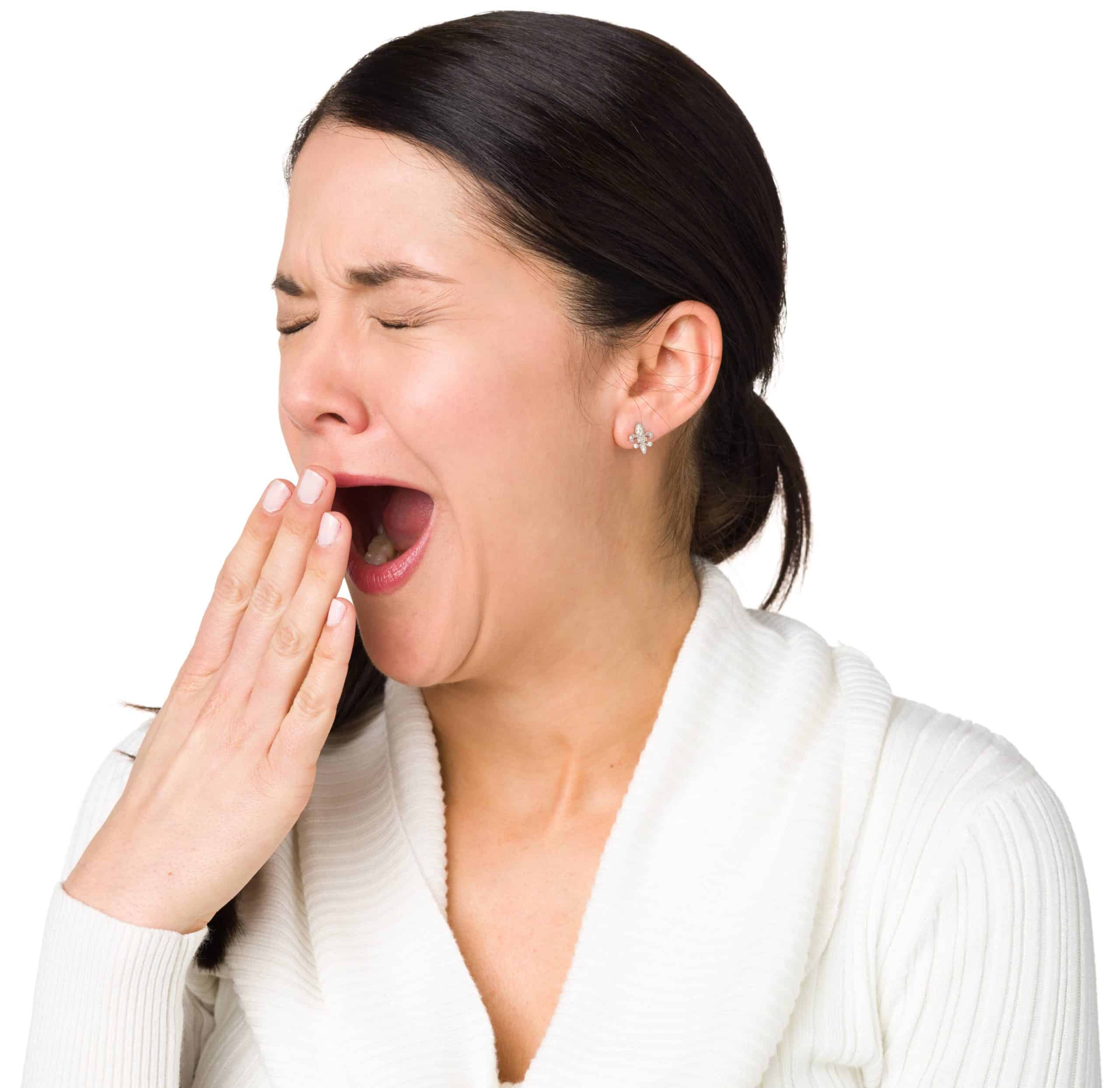 woman with sleep apnea yawning