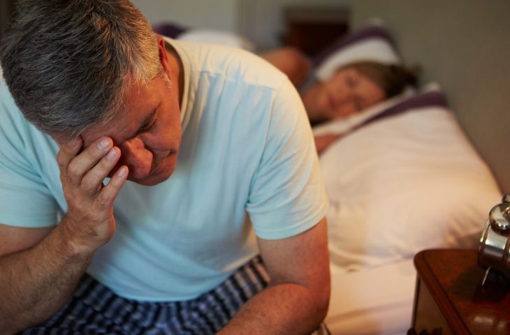 man suffering from a sleep disorder