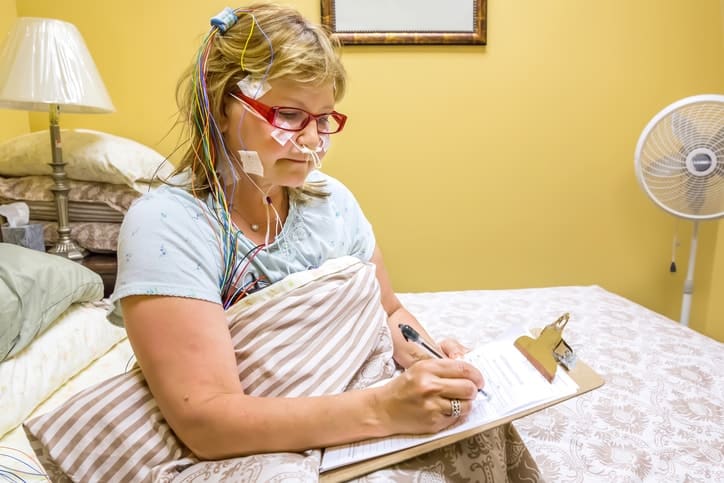 Woman filling out forms before a Sleep test