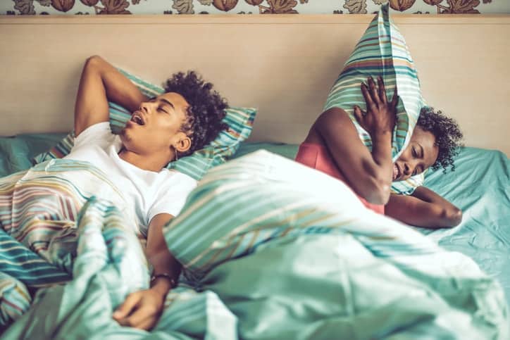Women has trouble sleeping while partner snores