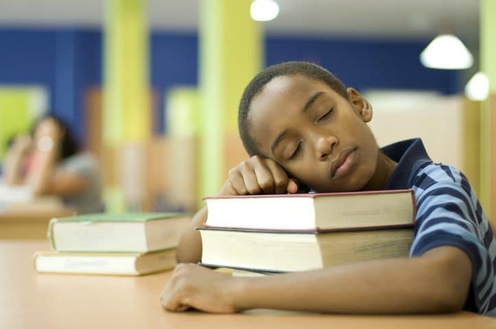 child sleeping in school