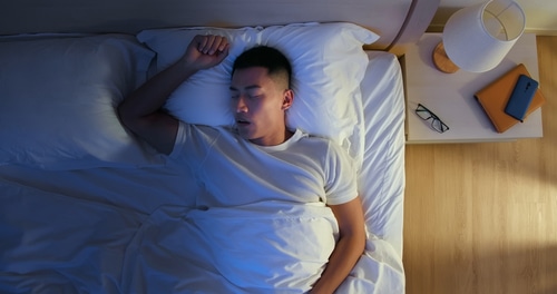 young man snores when he sleep at night